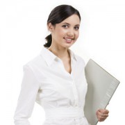 Portrait of elegant businesswoman with folder in hand looking at camera and smiling